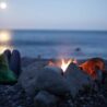 moonlight on a beach with fire for Erling's yoga B&B at erling.yoga