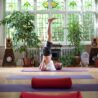man in shoulder stand in yoga room for scaravelli yoga with erling at erling.yoga