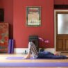 yoga woman lying on her back with her knees up and feet on the floor for a blog on why to practice yoga on erling.yoga