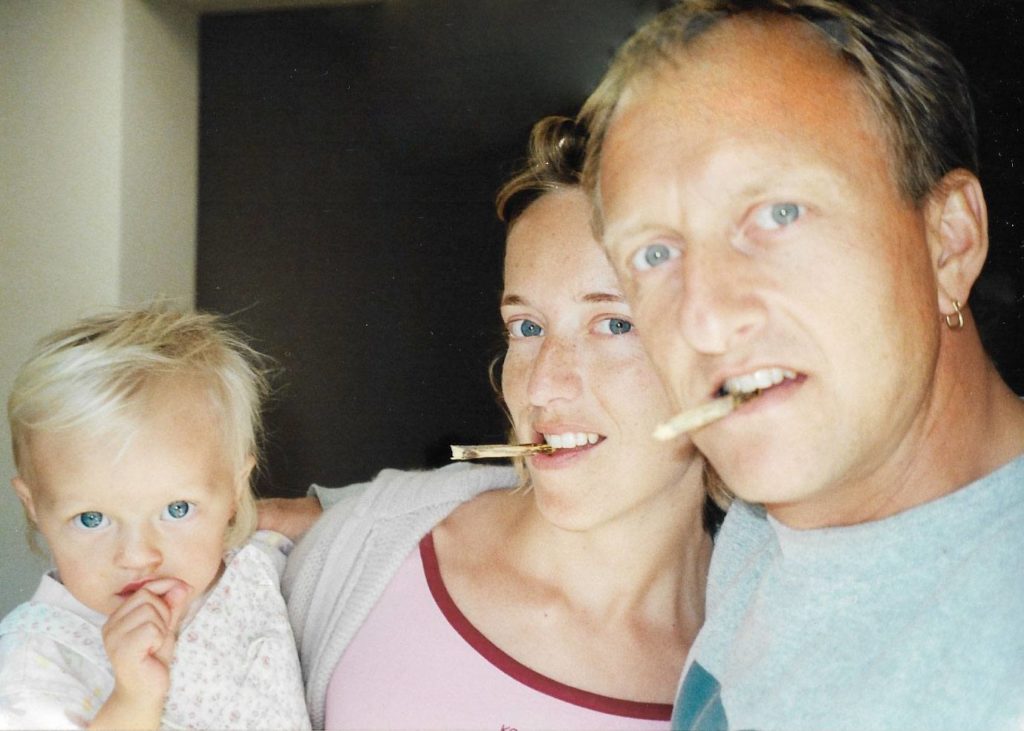 image of mum dad and toddler chewing liquorice (licorice) root sticks Glycyrrhiza glabra a liquorice family portrait for a blog on erling.yoga