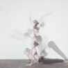 Freeze framed image of girl moving in a yoga pose zoom online yoga workshops