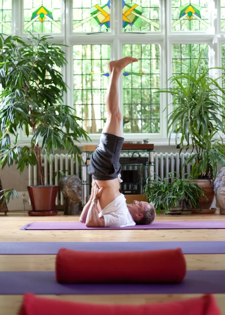Yoga headstand in the studio