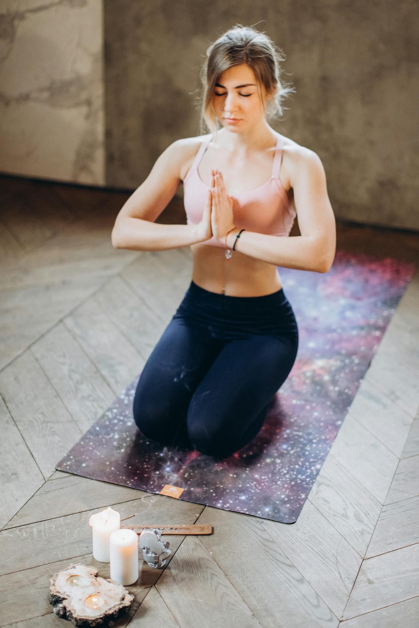 a woman practicing meditation indoors on a